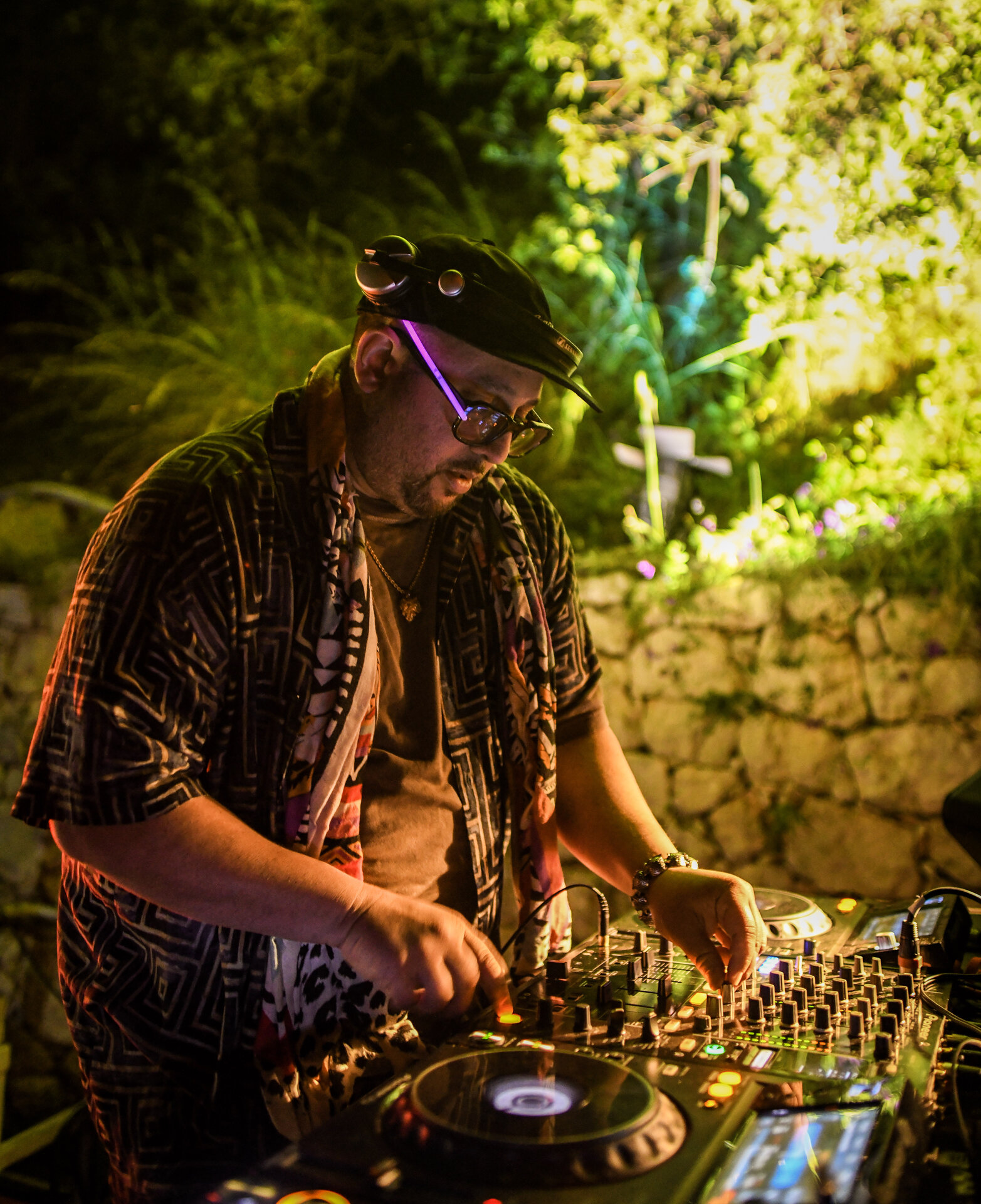 Electronic artist performing as the crowd reacts on the floor